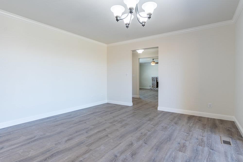 1220 Heather Glen Circle Hollister, CA 95023 - Photo 13 of 41 a view of an empty room with wooden floor