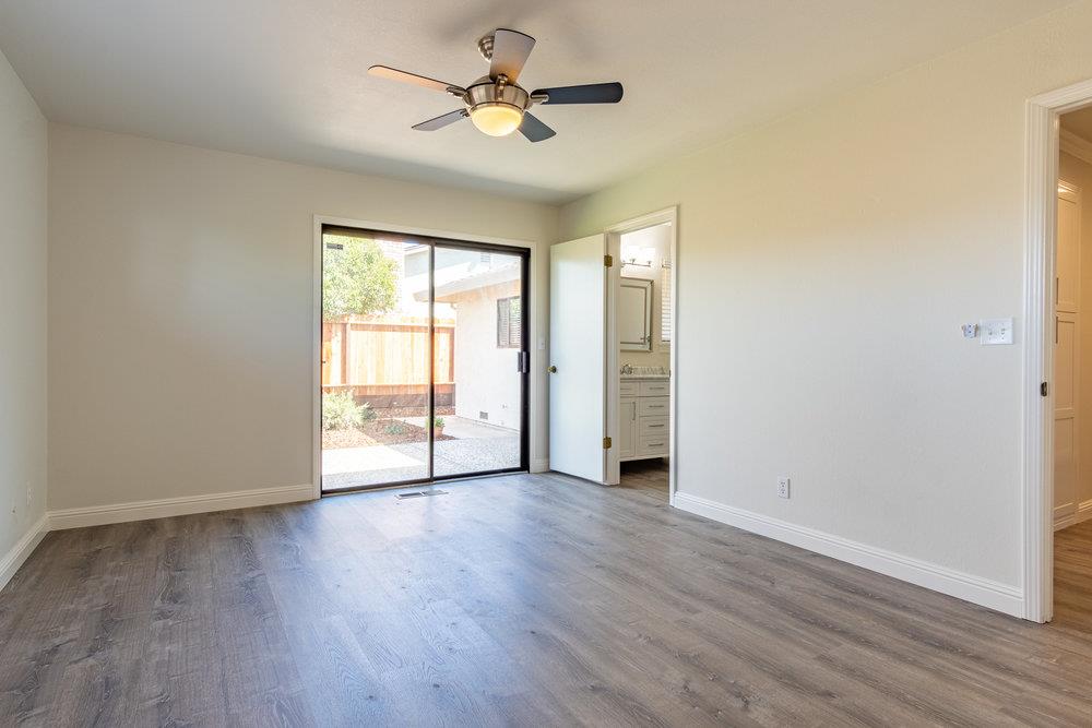 1220 Heather Glen Circle Hollister, CA 95023 - Photo 24 of 41 an empty room with wooden floor and ceiling fan