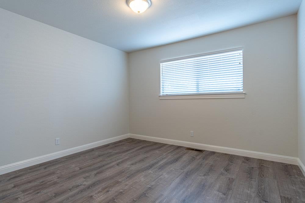 1220 Heather Glen Circle Hollister, CA 95023 - Photo 33 of 41 wooden floor in an empty room with a window