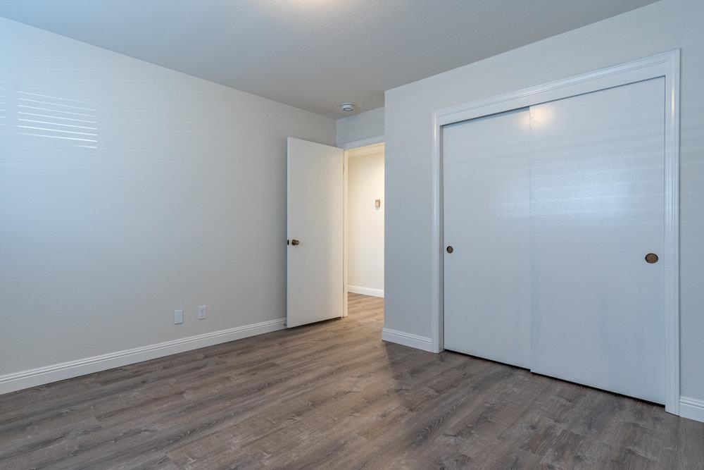 1220 Heather Glen Circle Hollister, CA 95023 - Photo 34 of 41 a view of an empty room with wooden floor and closet area