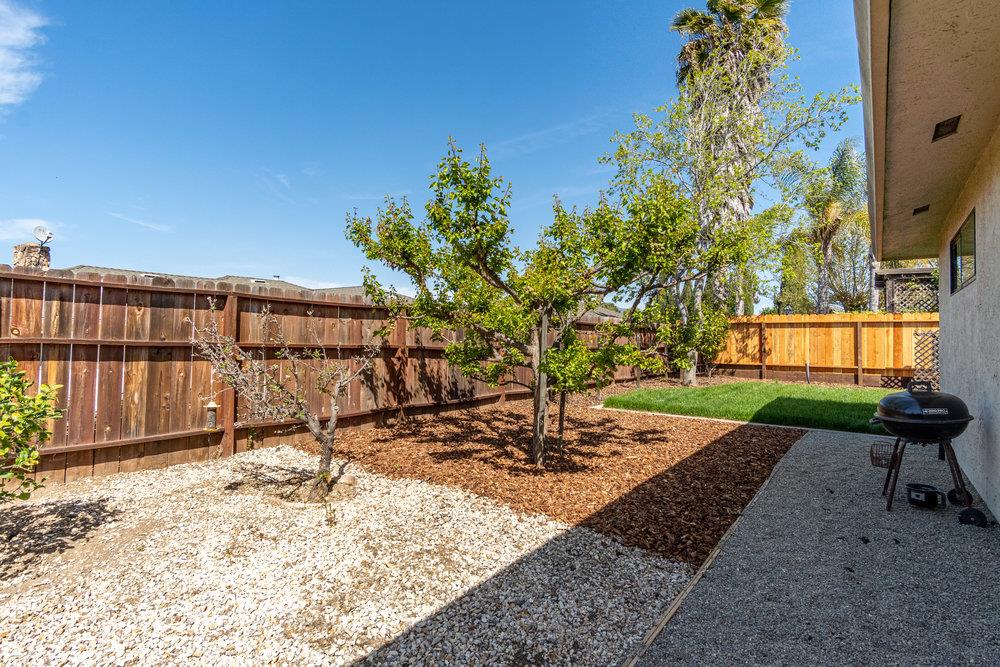 1220 Heather Glen Circle Hollister, CA 95023 - Photo 40 of 41 a view of a backyard with a bench