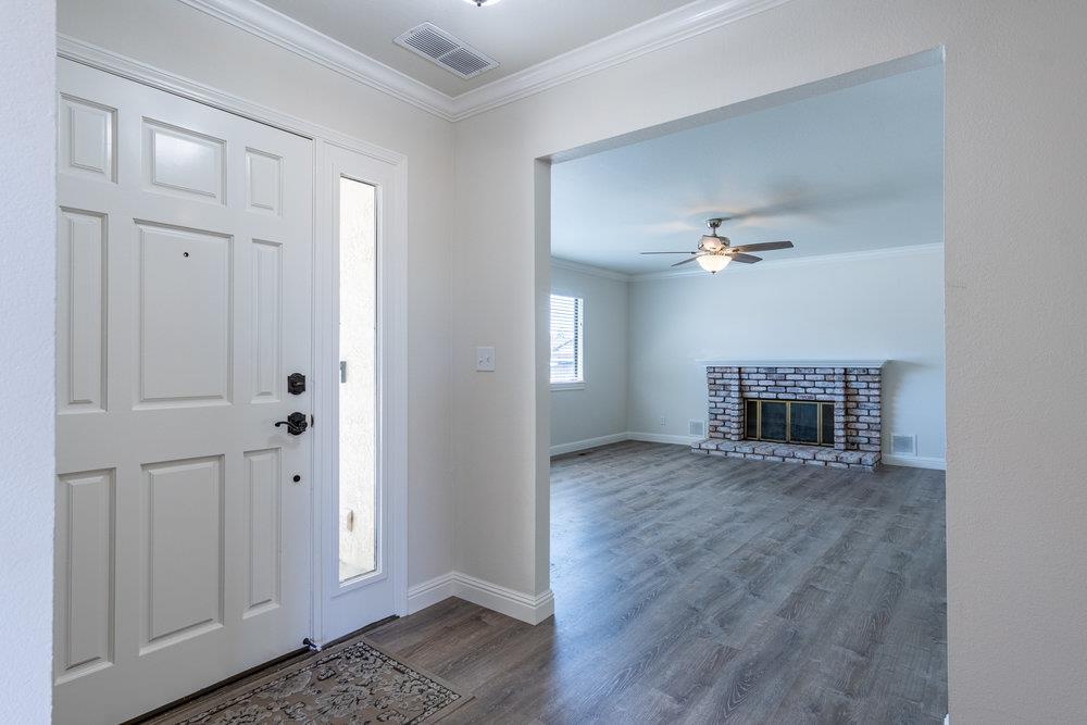 1220 Heather Glen Circle Hollister, CA 95023 - Photo 5 of 41 a view of a livingroom with wooden floor closet and staircase