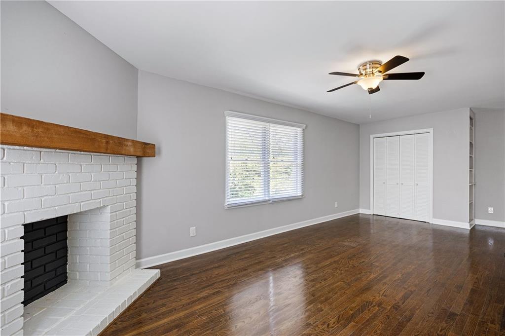 45 Smyrna Powder Springs Road Southeast Marietta, GA 30060 - Photo 18 of 45 a view of empty room with wooden floor and fan