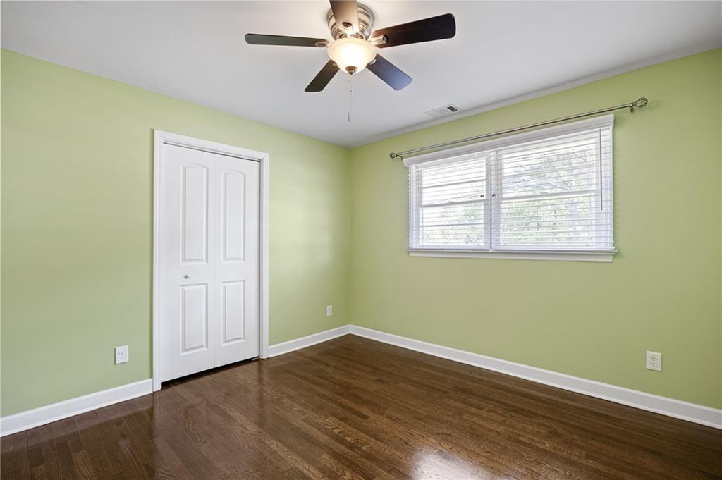 45 Smyrna Powder Springs Road Southeast Marietta, GA 30060 - Photo 19 of 45 a view of room with window ceiling fan and hardwood floor