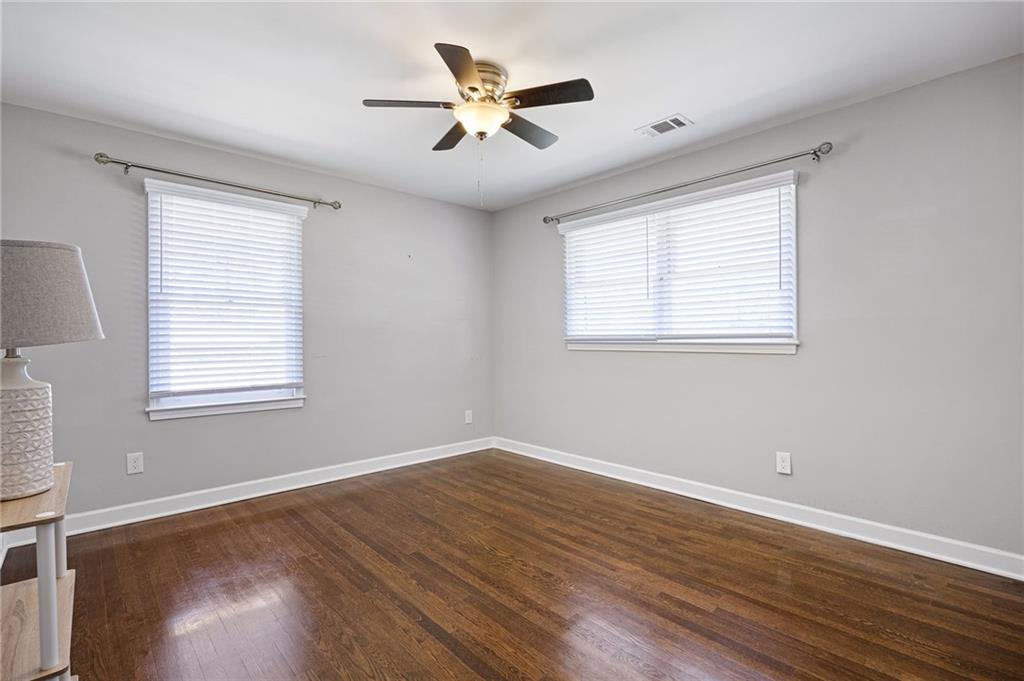 45 Smyrna Powder Springs Road Southeast Marietta, GA 30060 - Photo 21 of 45 a view of a livingroom with a hardwood floor and a ceiling fan