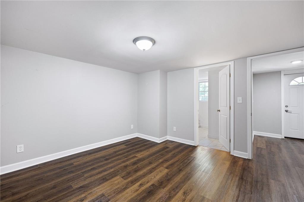 45 Smyrna Powder Springs Road Southeast Marietta, GA 30060 - Photo 30 of 45 a view of an empty room with wooden floor