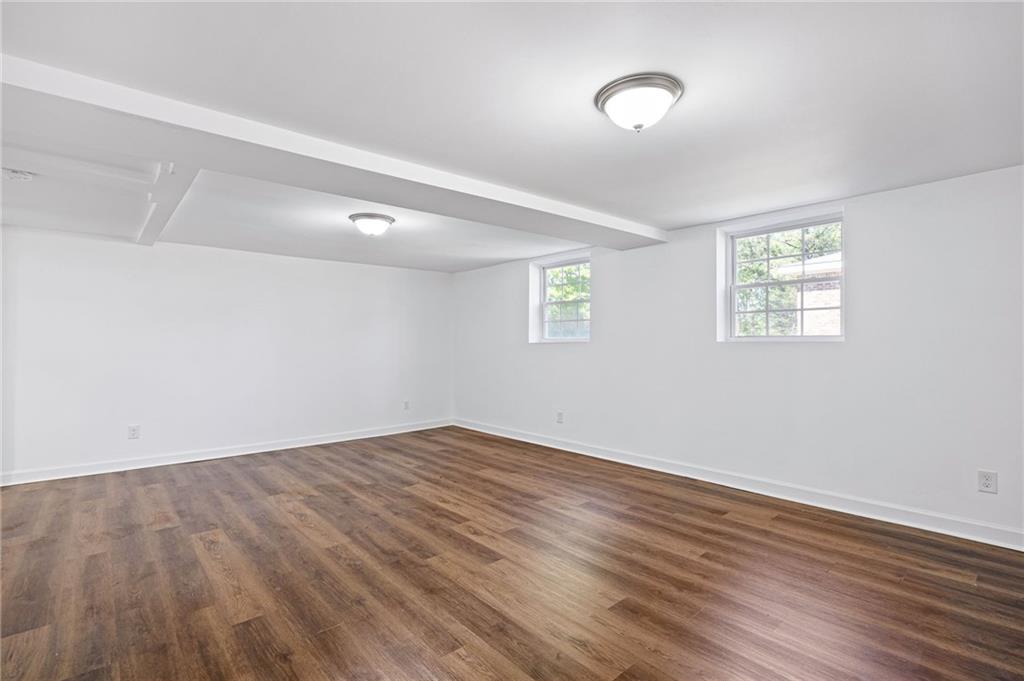 45 Smyrna Powder Springs Road Southeast Marietta, GA 30060 - Photo 33 of 45 an empty room with wooden floor and windows