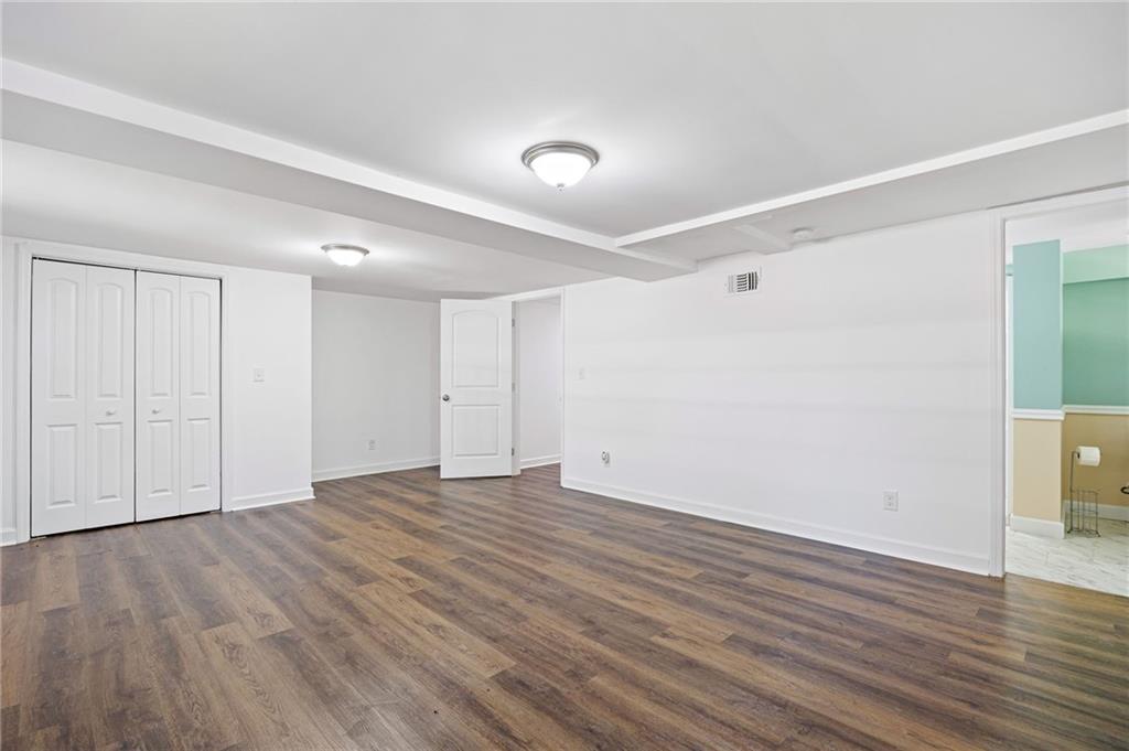 45 Smyrna Powder Springs Road Southeast Marietta, GA 30060 - Photo 34 of 45 a view of an empty room with wooden floor