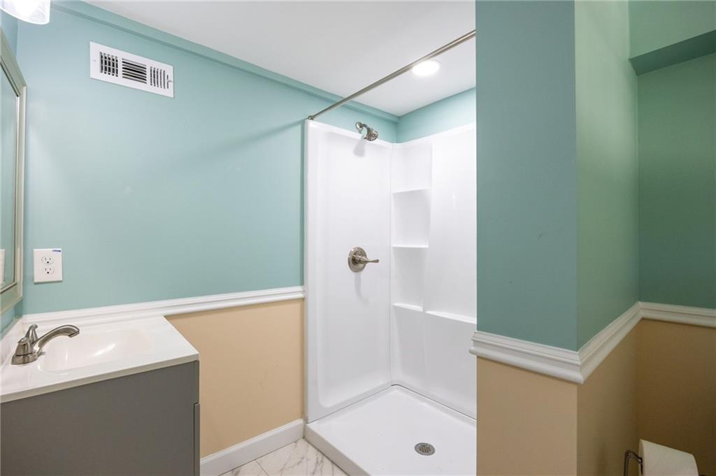 45 Smyrna Powder Springs Road Southeast Marietta, GA 30060 - Photo 35 of 45 a bathroom with a shower and a sink