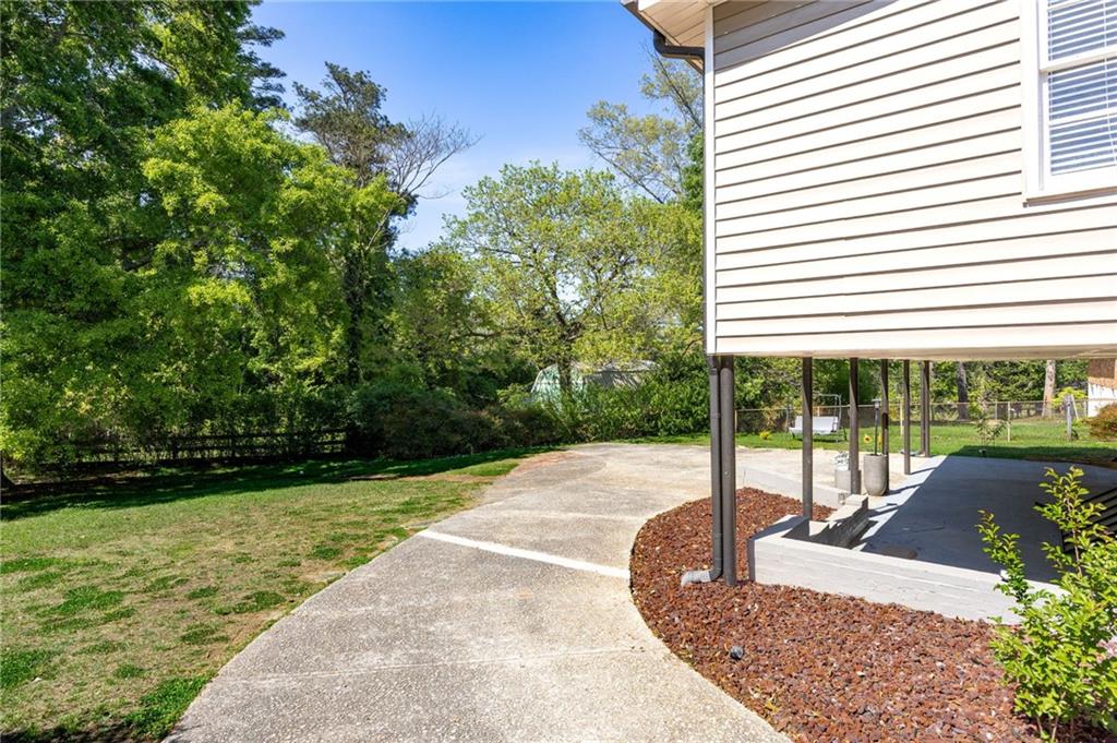 45 Smyrna Powder Springs Road Southeast Marietta, GA 30060 - Photo 36 of 45 a view of a backyard with plants and patio