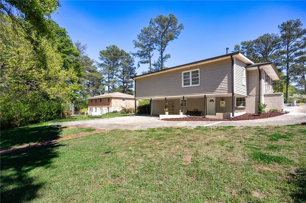 45 Smyrna Powder Springs Road Southeast Marietta, GA 30060 - Photo 38 of 45 a front view of a house with a yard and a porch