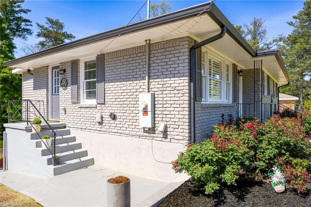 45 Smyrna Powder Springs Road Southeast Marietta, GA 30060 - Photo 39 of 45 front view of a house with a yard