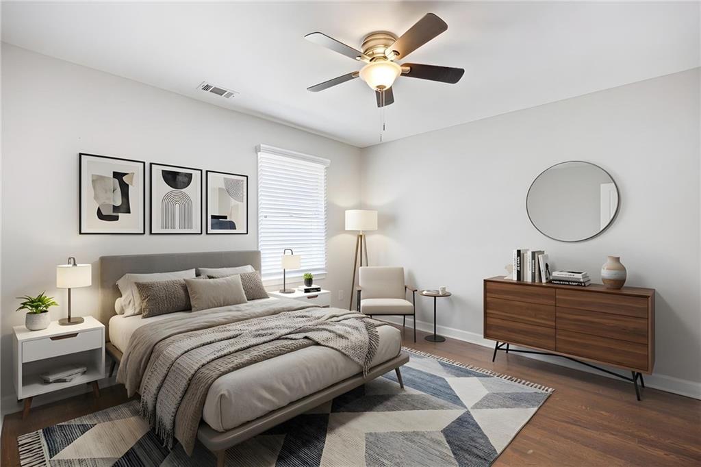 45 Smyrna Powder Springs Road Southeast Marietta, GA 30060 - Photo 4 of 45 a bedroom with a bed and a chandelier