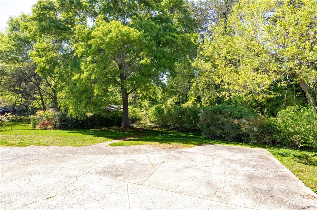 45 Smyrna Powder Springs Road Southeast Marietta, GA 30060 - Photo 41 of 45 a view of swimming pool with an outdoor space and seating area