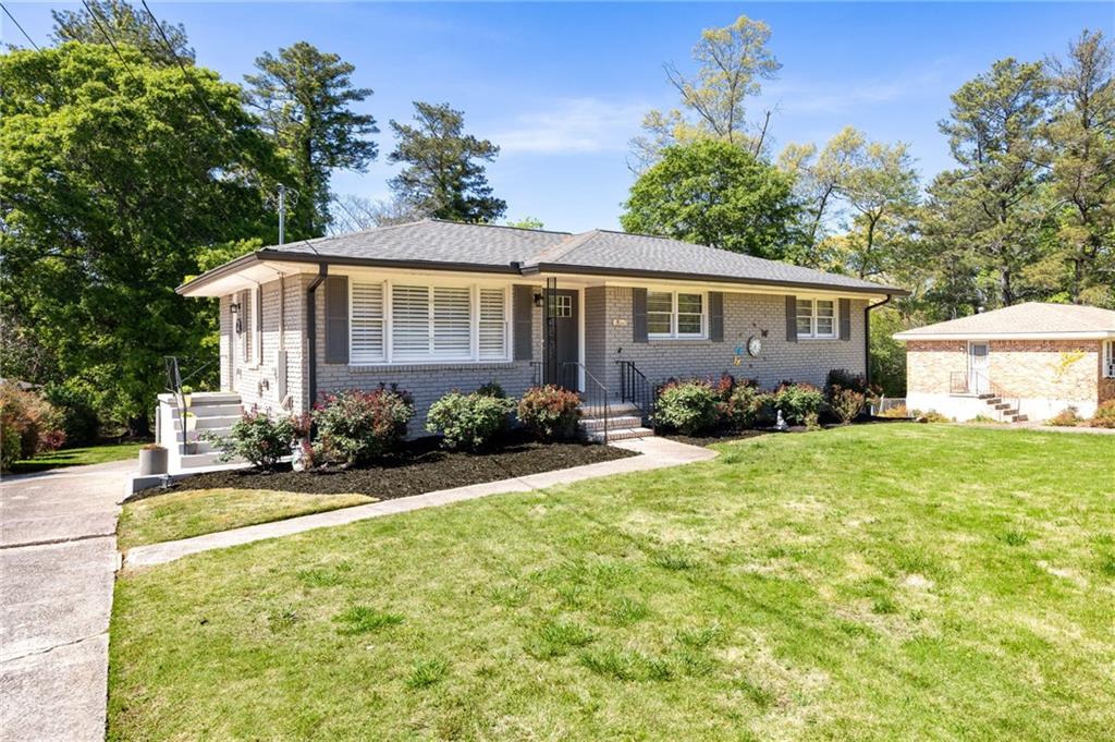 45 Smyrna Powder Springs Road Southeast Marietta, GA 30060 - Photo 42 of 45 a front view of a house with garden
