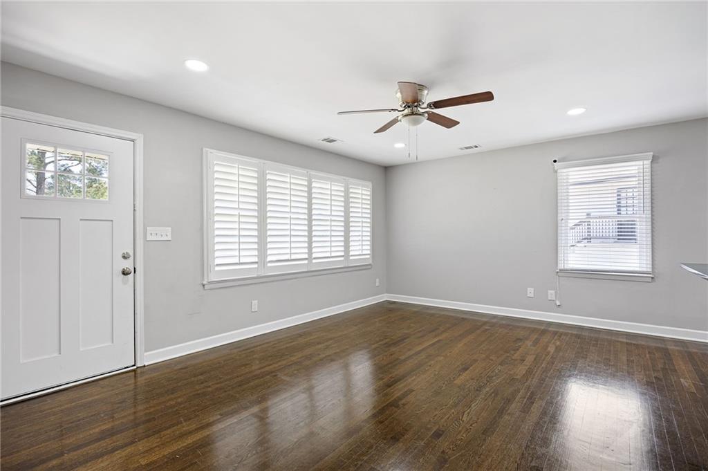 45 Smyrna Powder Springs Road Southeast Marietta, GA 30060 - Photo 6 of 45 a view of an empty room with wooden floor and a window
