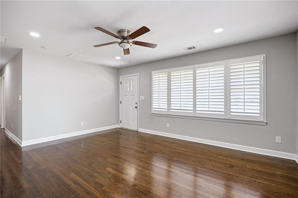 45 Smyrna Powder Springs Road Southeast Marietta, GA 30060 - Photo 7 of 45 a view of an empty room with wooden floor and a window