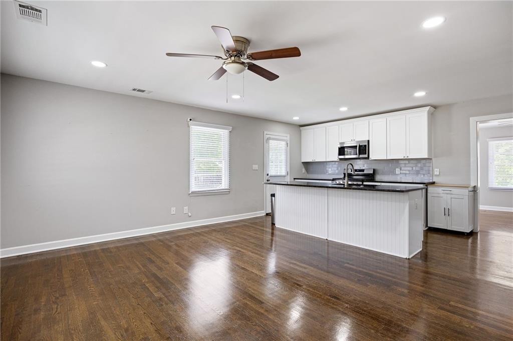 45 Smyrna Powder Springs Road Southeast Marietta, GA 30060 - Photo 8 of 45 a kitchen with a refrigerator and white cabinets