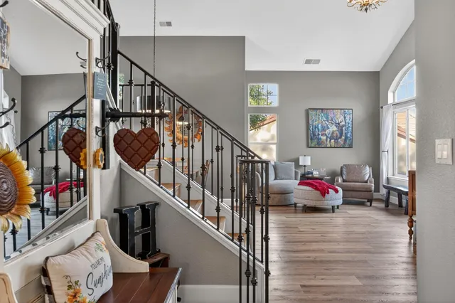 a bathroom with a granite countertop sink mirror and vanity