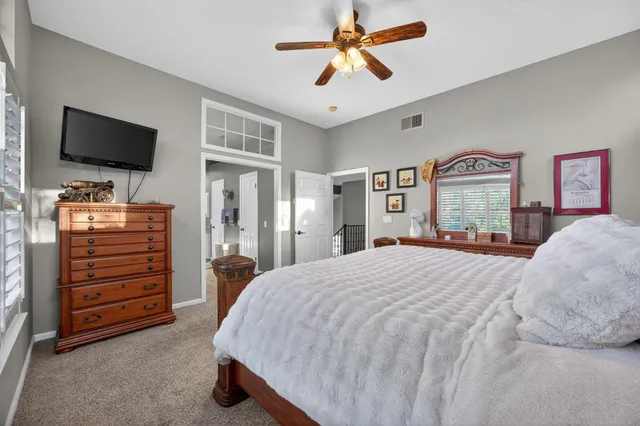 a front view of a house with garden and porch
