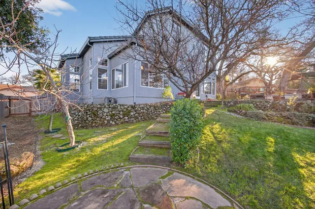 a view of swimming pool with outdoor seating and a pathway