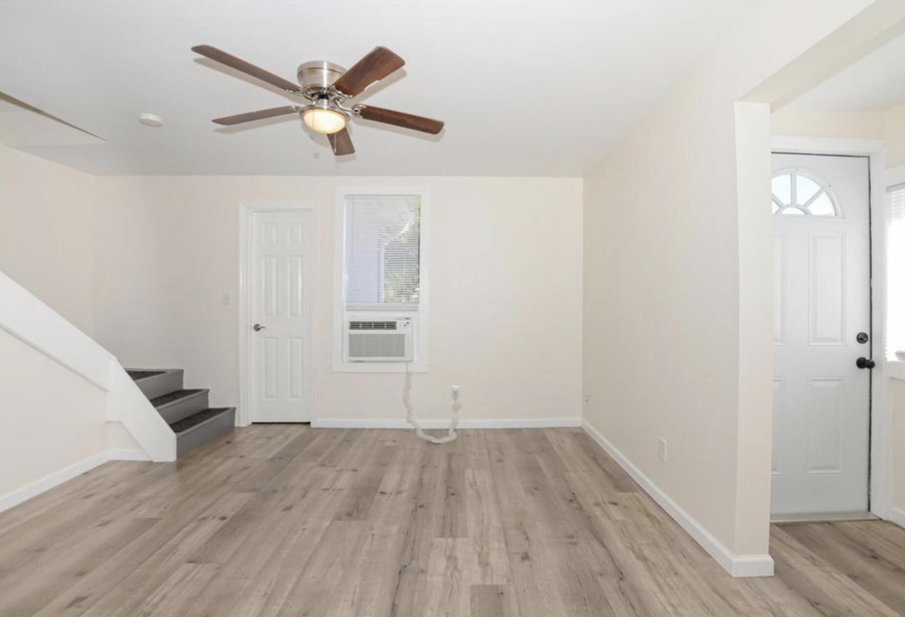 119 South 11th Street Fort Pierce, FL 34950 - Photo 16 of 22 wooden floor in an empty room with a window