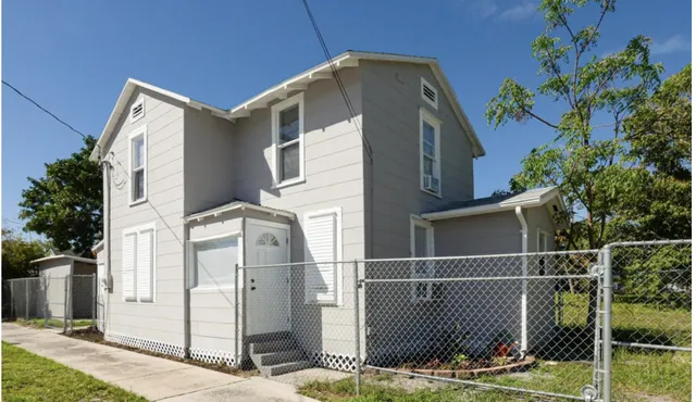 a front view of a house with garage