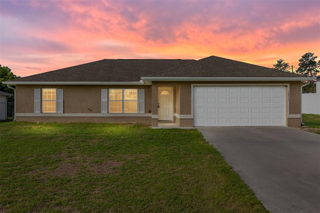 16362 Southwest 27th Terrace Road Ocala, FL 34473 - Photo 1 of 1 a front view of house with yard and green space