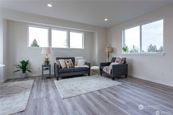 1024 North 8th Street Mount Vernon, WA 98273 - Photo 15 of 37 a living room with furniture and a large window