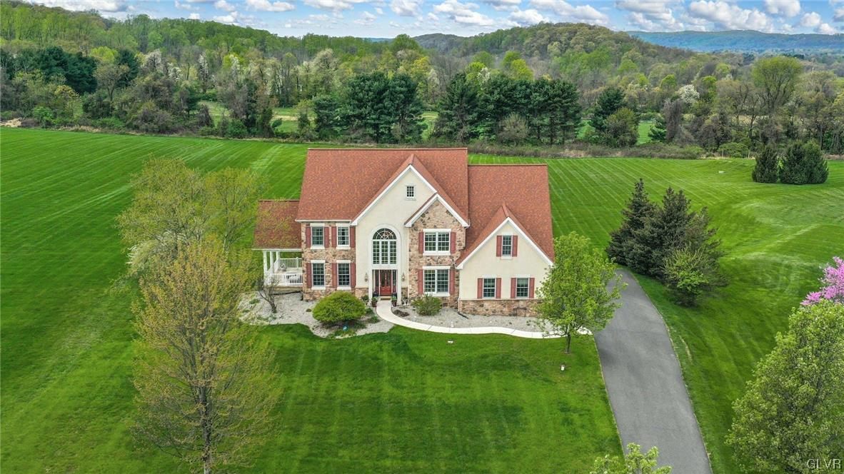 1560 Jakes Place Hellertown, PA 18055 - Photo 1 of 38 a view of a house with a yard and sitting area