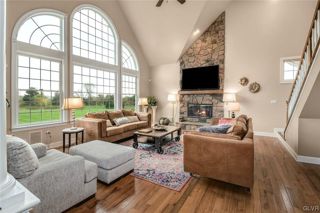 1560 Jakes Place Hellertown, PA 18055 - Photo 14 of 38 a living room with fireplace furniture and a flat screen tv
