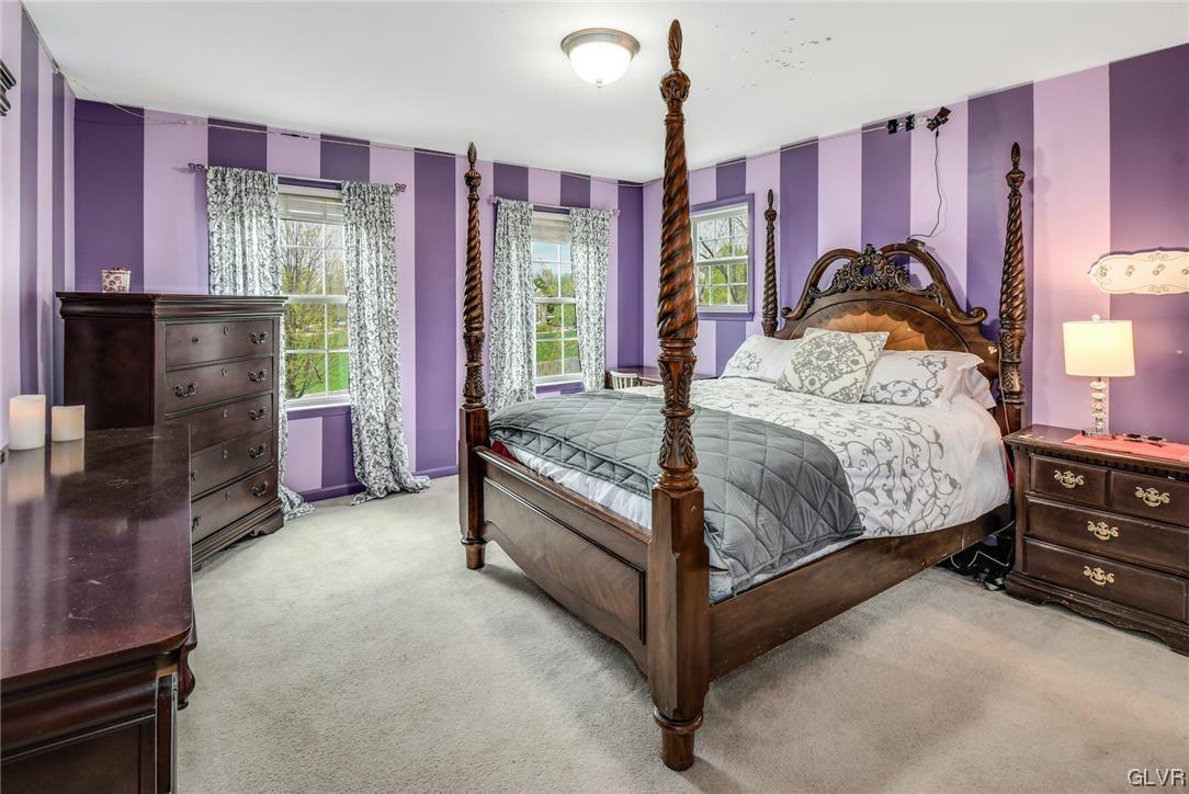 1560 Jakes Place Hellertown, PA 18055 - Photo 22 of 38 a bedroom with a bed and large windows
