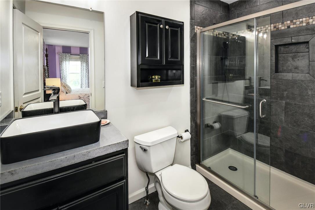 1560 Jakes Place Hellertown, PA 18055 - Photo 23 of 38 a bathroom with a sink a toilet and shower