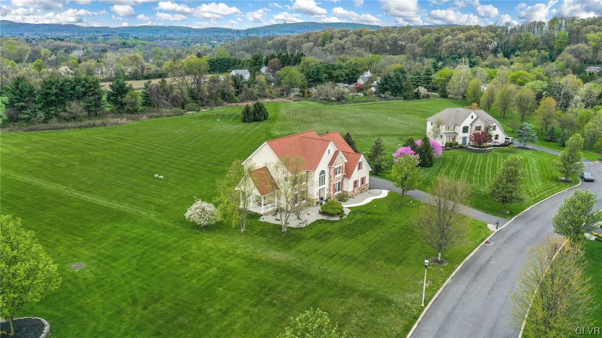 1560 Jakes Place Hellertown, PA 18055 - Photo 3 of 38 a view of a table and chairs in the garden