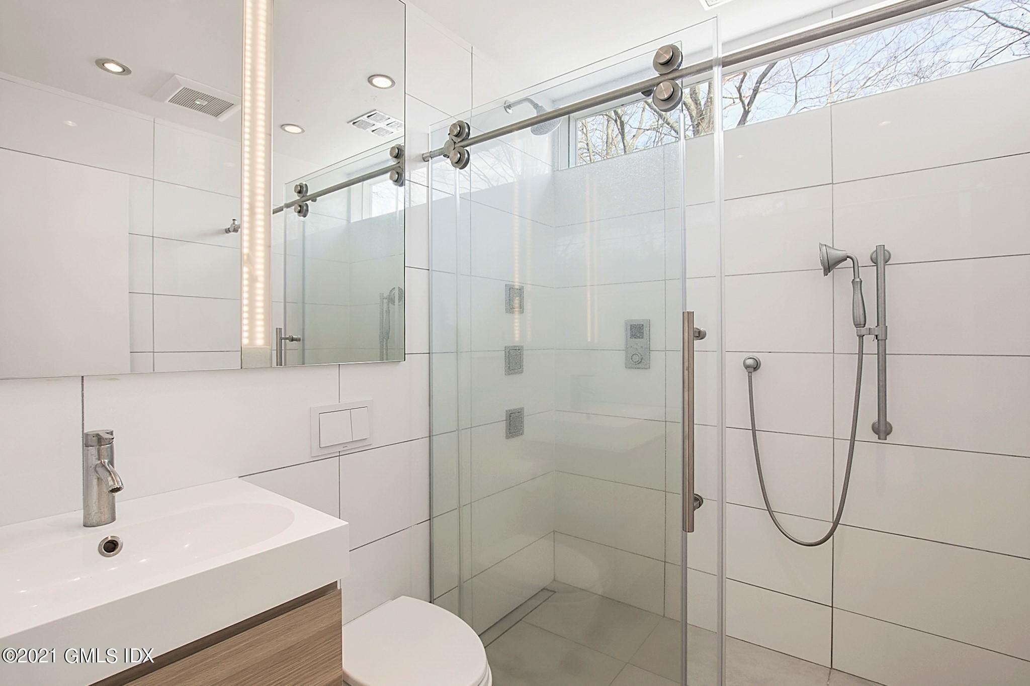 15 Hycliff Road Greenwich, CT 06831 - Photo 16 of 27 a bathroom with a shower and a sink