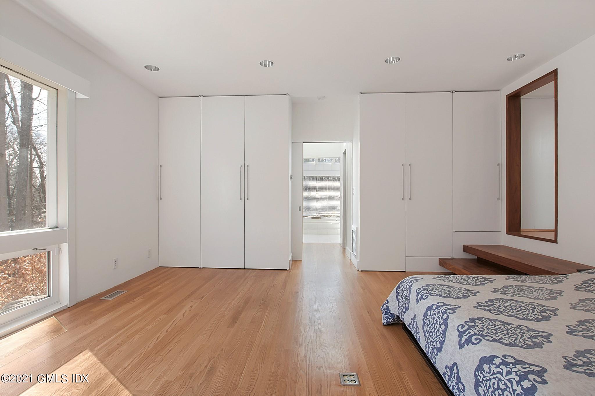 15 Hycliff Road Greenwich, CT 06831 - Photo 22 of 27 a bedroom with a bed and a window