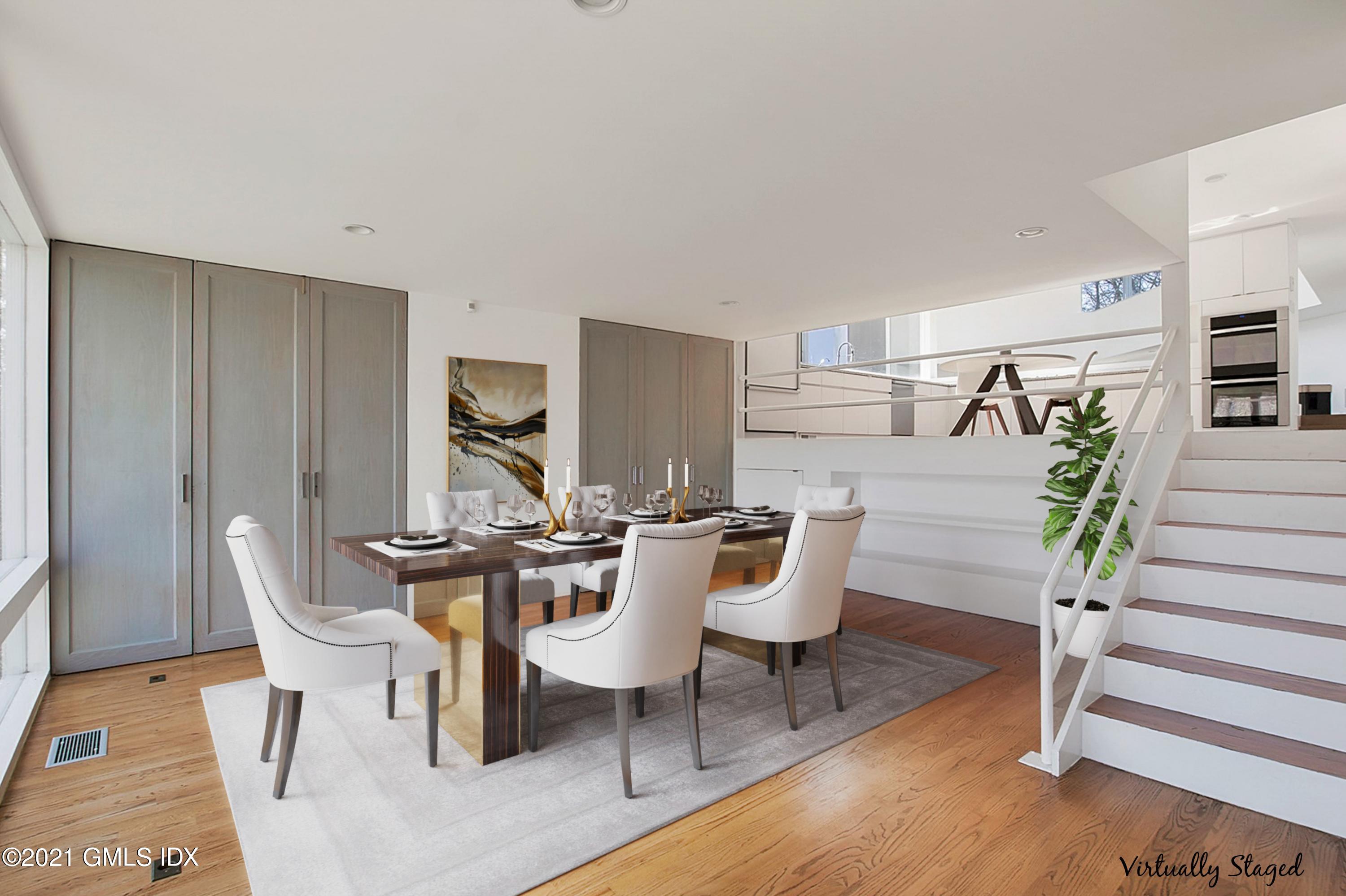 15 Hycliff Road Greenwich, CT 06831 - Photo 8 of 27 a dining room with furniture and wooden floor