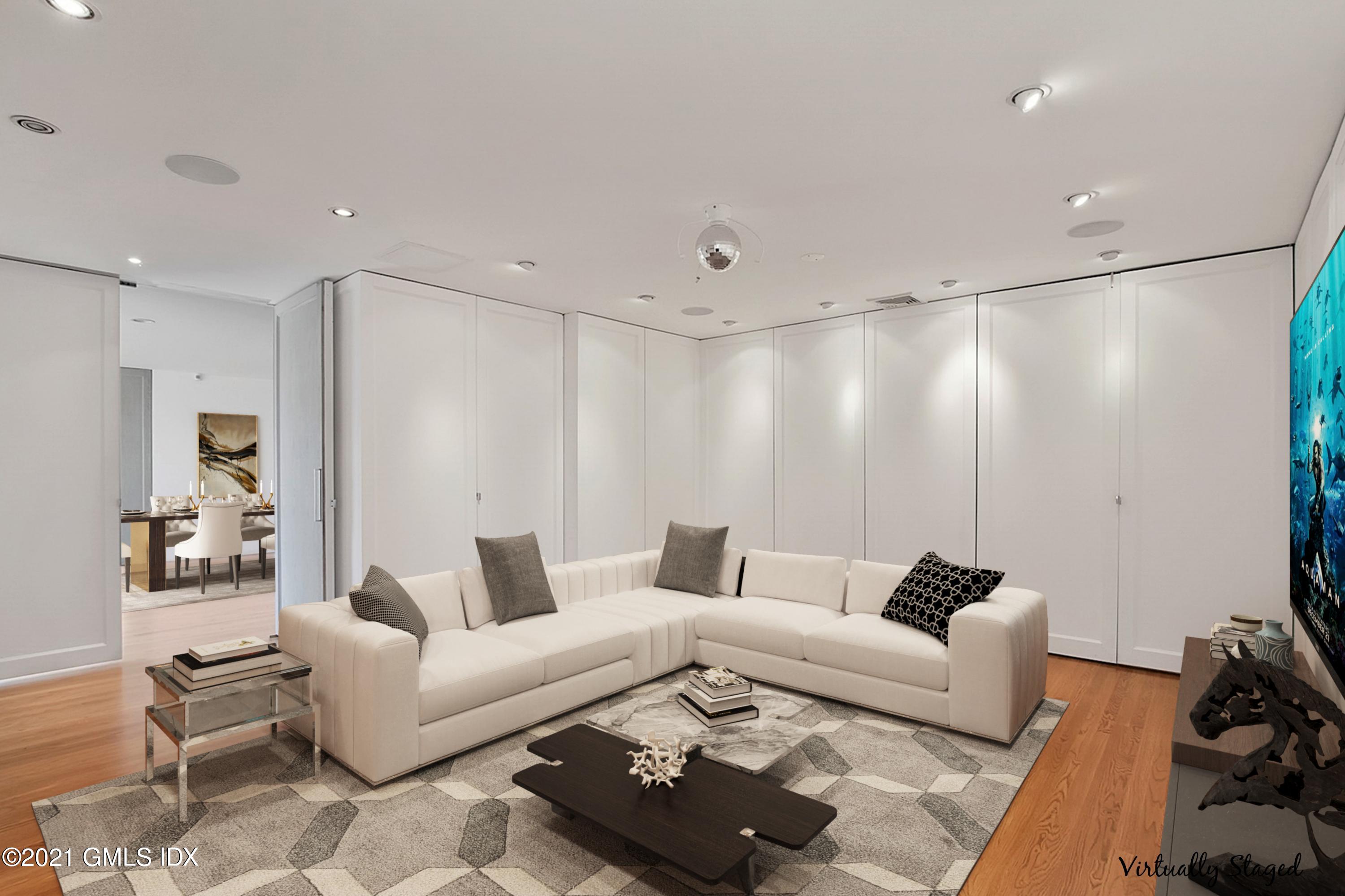 15 Hycliff Road Greenwich, CT 06831 - Photo 9 of 27 a living room with furniture and a couch