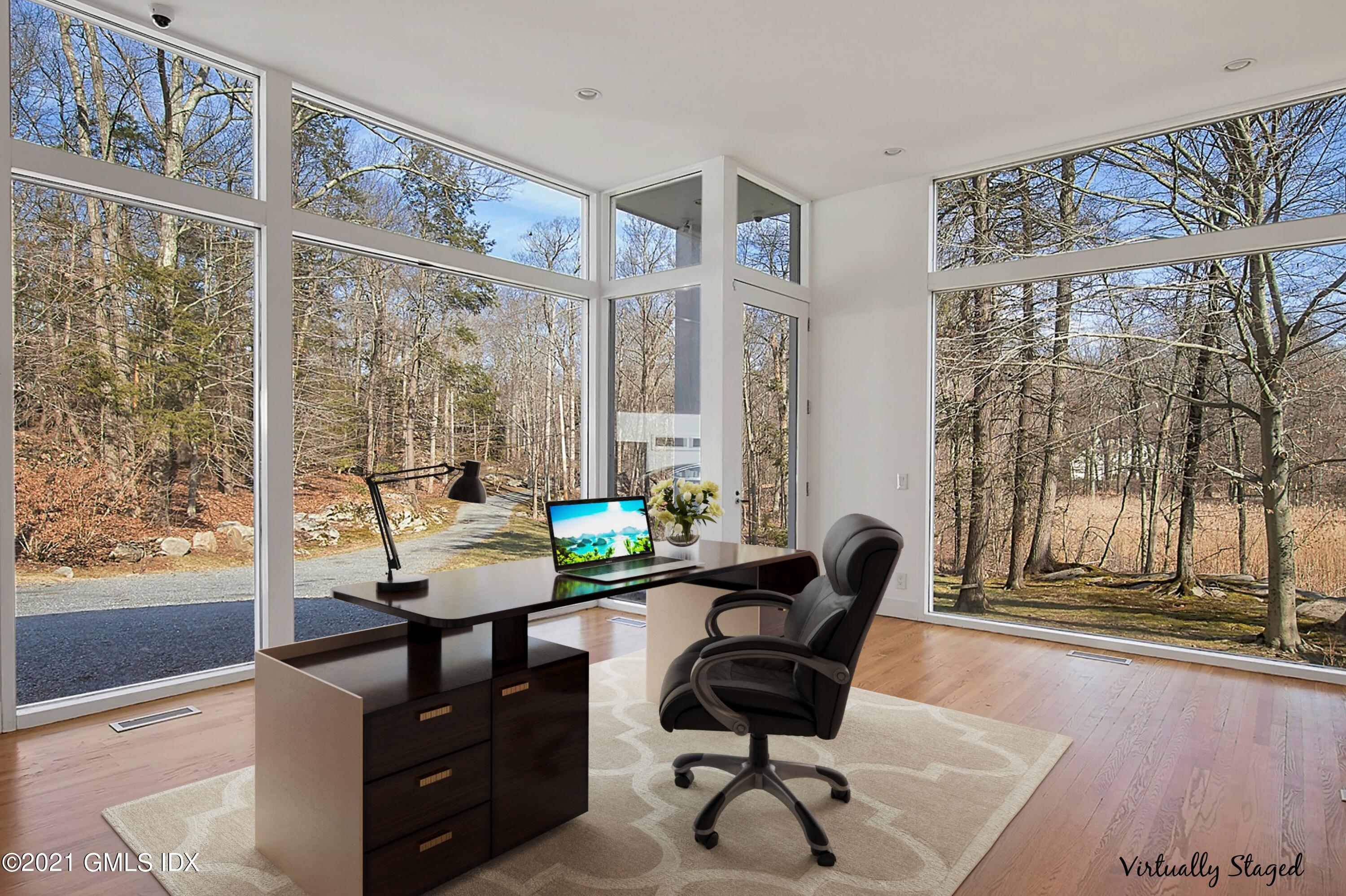 15 Hycliff Road Greenwich, CT 06831 - Photo 10 of 27 a work room with furniture and large windows