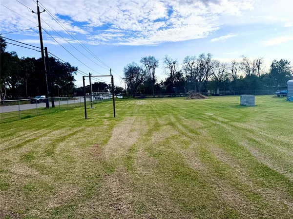 a view of a big yard with a fountain