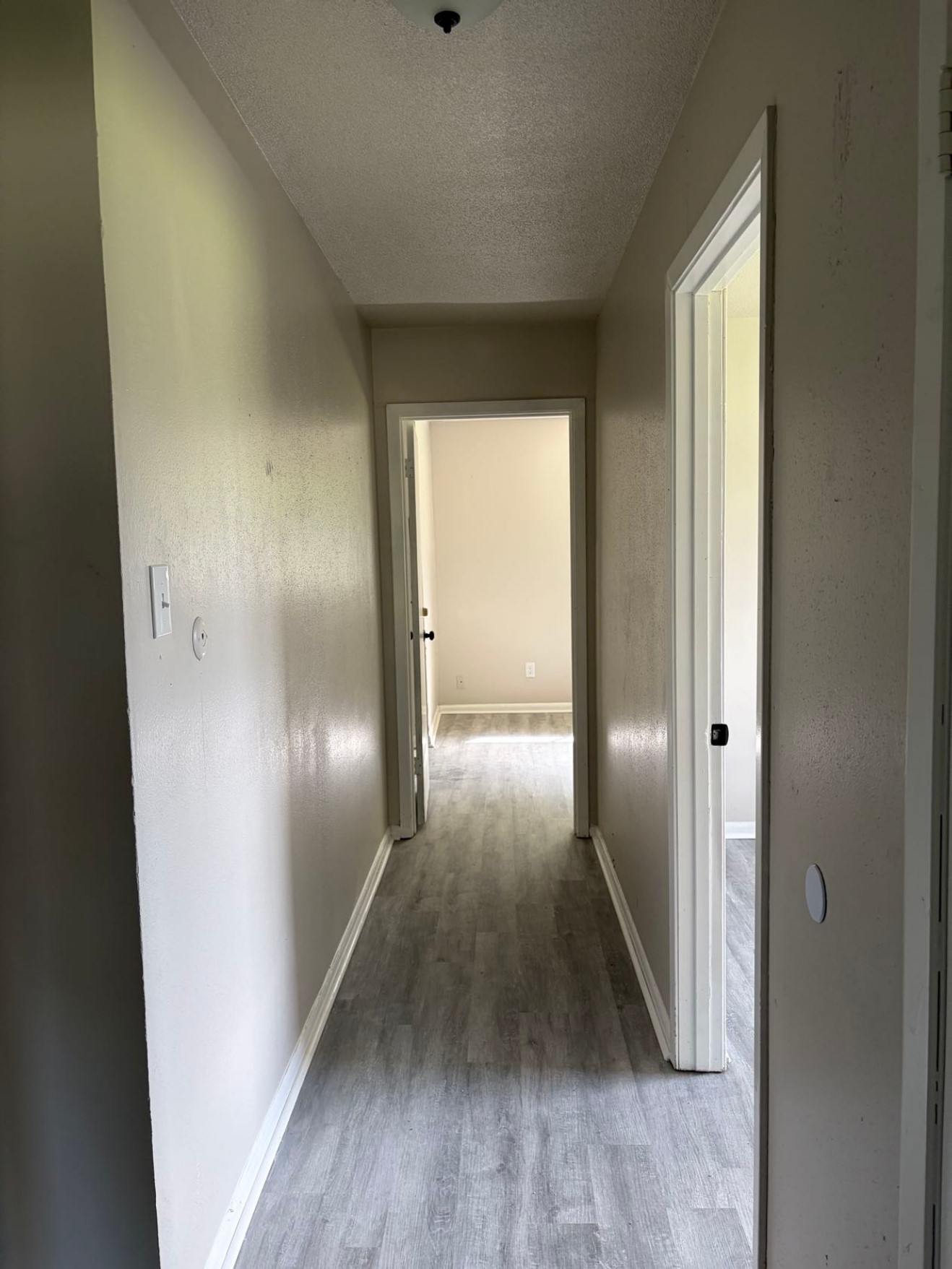 5890 Helbig Road Beaumont, TX 77708 - Photo 12 of 31 a view of a hallway with wooden floor