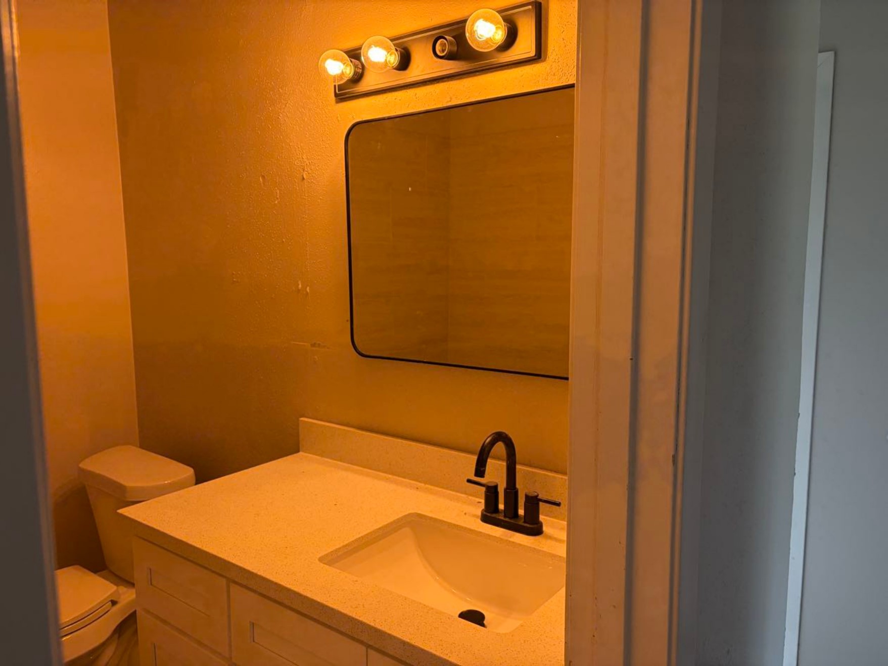 5890 Helbig Road Beaumont, TX 77708 - Photo 17 of 31 a bathroom with a sink and a mirror