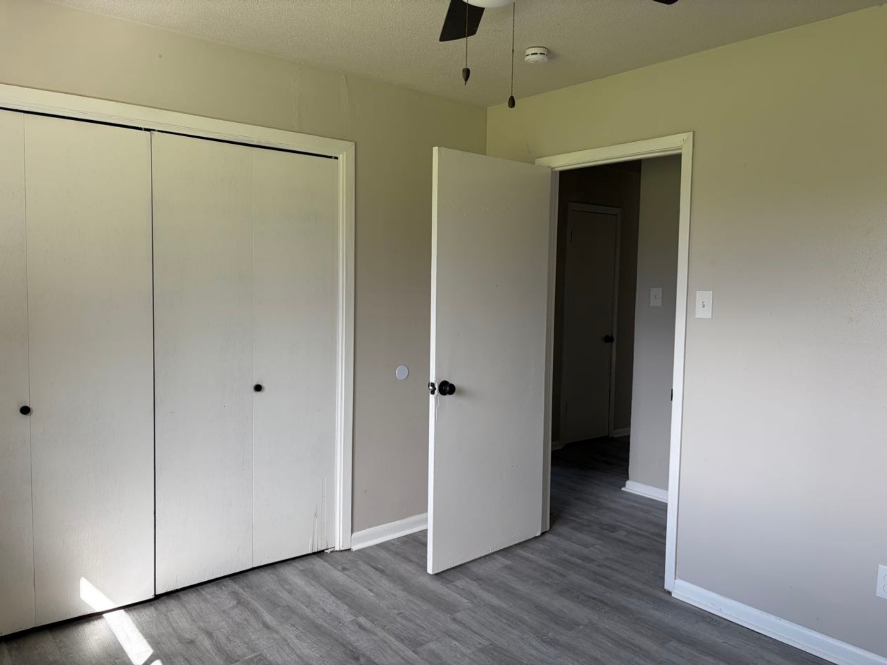 5890 Helbig Road Beaumont, TX 77708 - Photo 21 of 31 a view of an empty room with wooden floor
