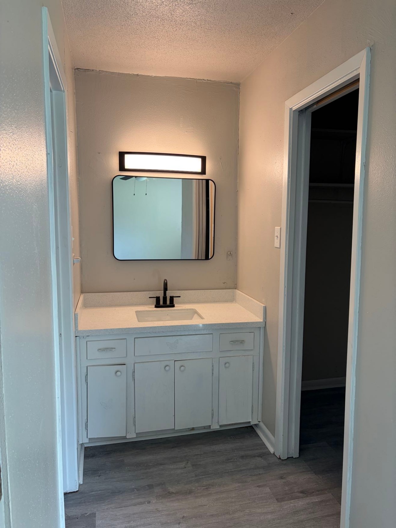 5890 Helbig Road Beaumont, TX 77708 - Photo 25 of 31 a bathroom with a double vanity sink and mirror