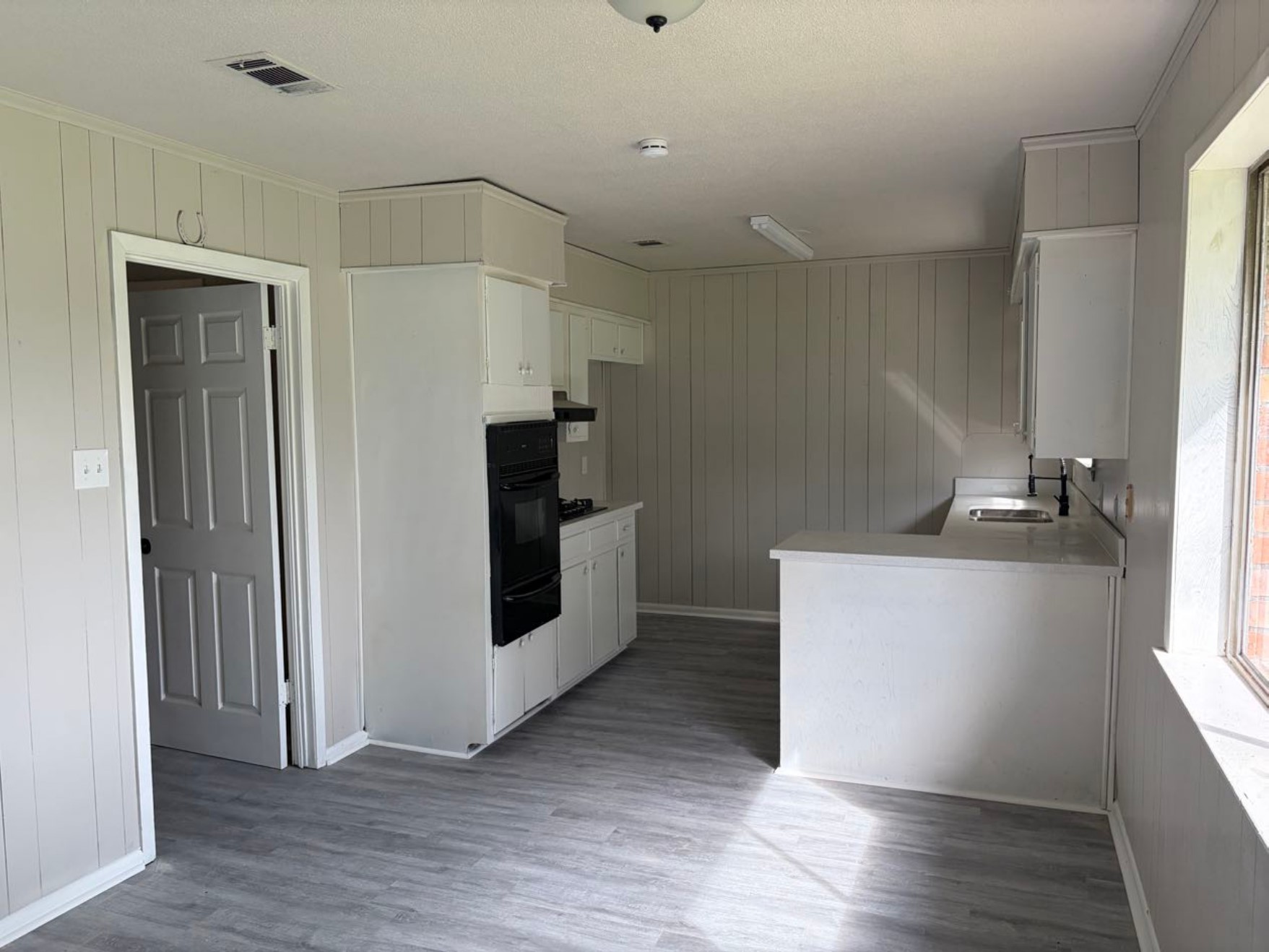 5890 Helbig Road Beaumont, TX 77708 - Photo 6 of 31 a kitchen with granite countertop a refrigerator and a stove