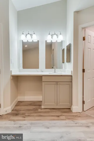a view of a bathroom sink vanity and a mirror