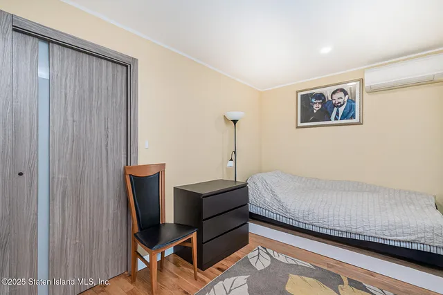 a bathroom with a sink a toilet a mirror and shower