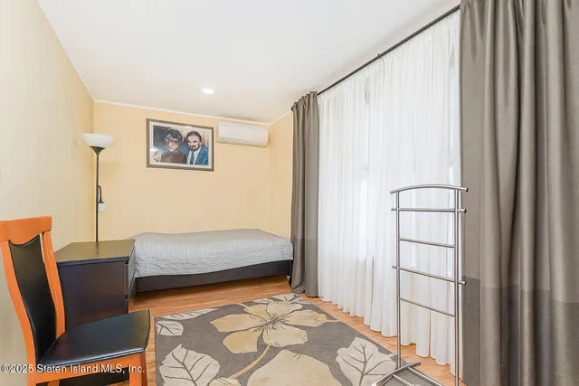 a view of a livingroom with furniture and staircase