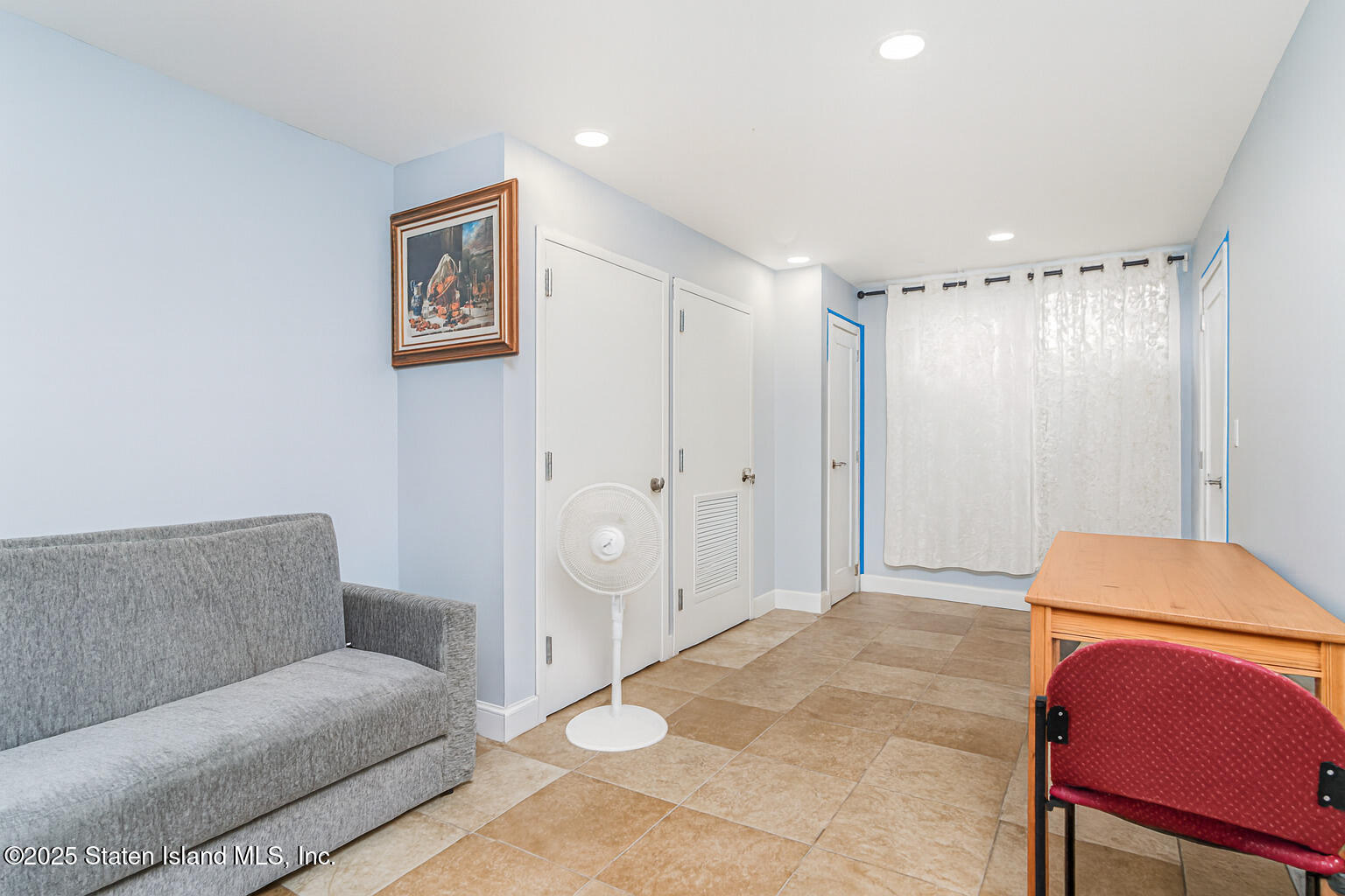Undisclosed Address Staten Island, NY 10309 - Photo 18 of 40 a living room with furniture and a closet