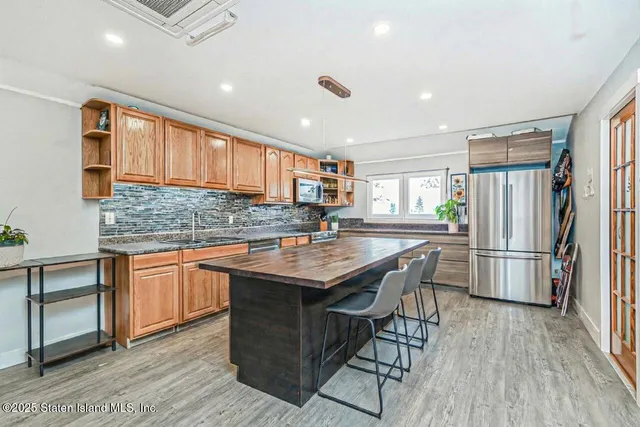 a bedroom with a bed and cabinets